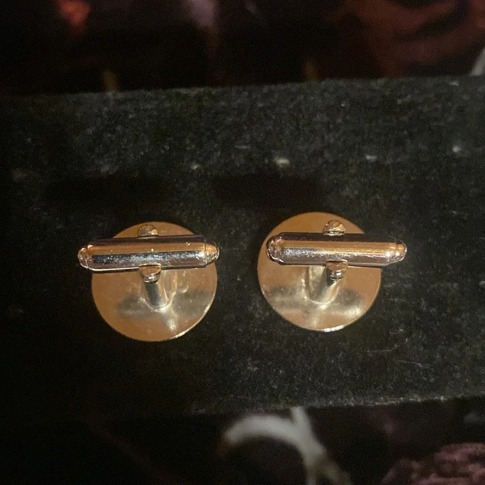 Set of 2 vintage cuff links.  Gold tone/ silver tone. Silver pair are Anson